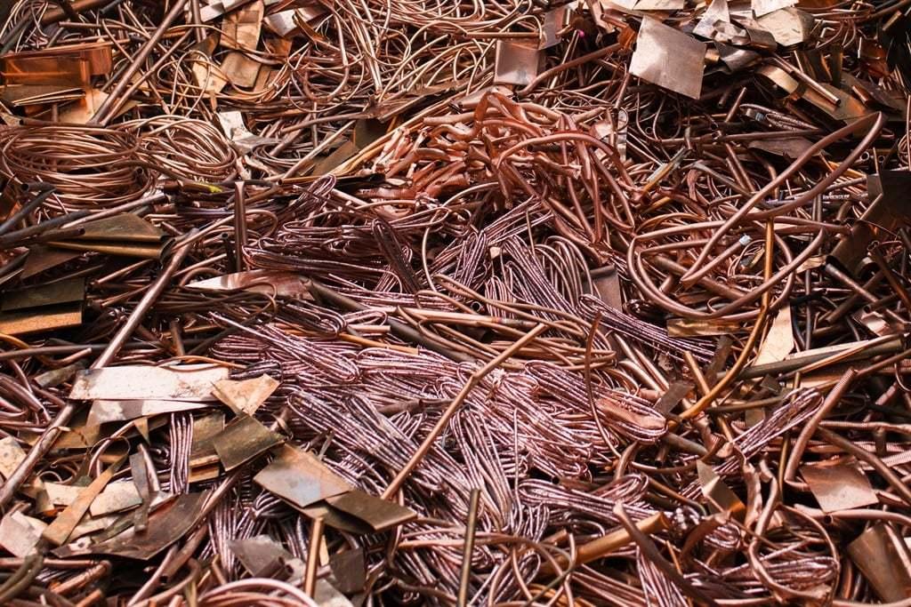Various recyclable metal scrap materials including steel, copper, and aluminum.